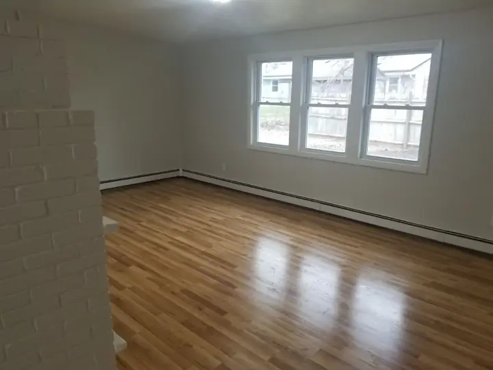 Living room flooring and paint by Tauro Builders