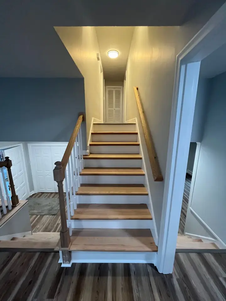 Stairway with new treads and risers by Tauro Builders