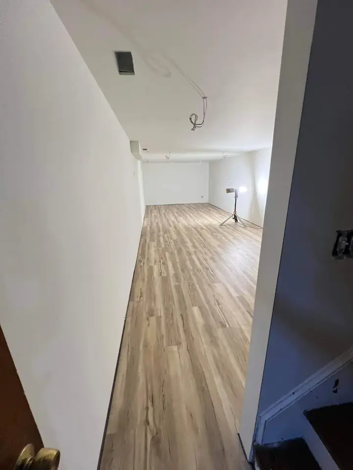 Hallway flooring installation by Tauro Builders