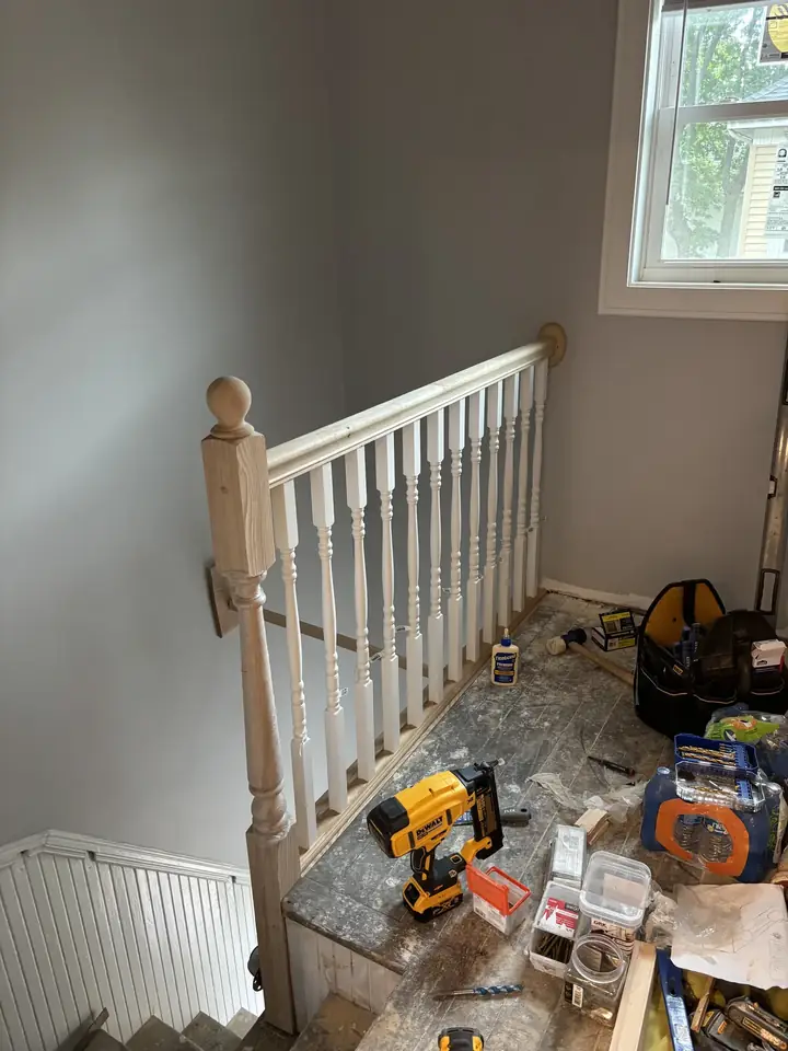Stair railing work in progress by Tauro Builders