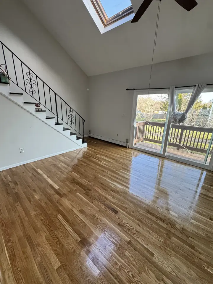 Vaulted living room and stairs by Tauro Builders