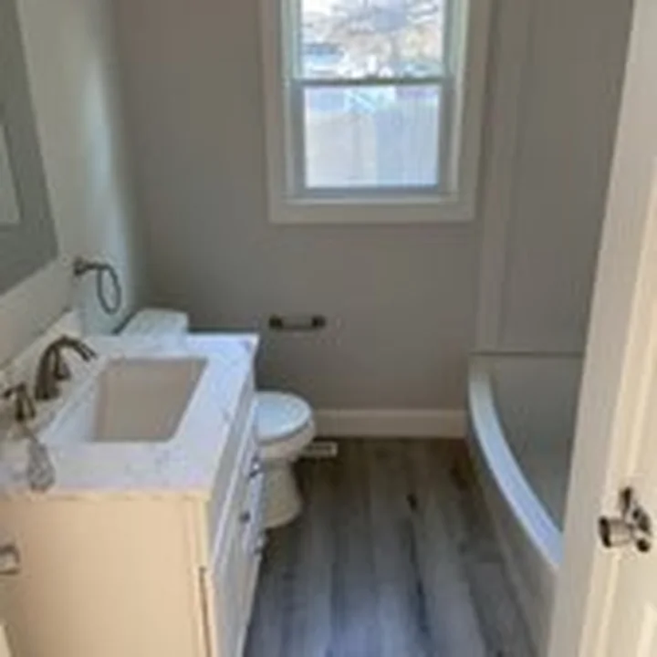 Bathroom with new vanity and tub by Tauro Builders