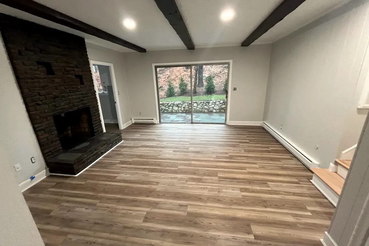 Beamed living room renovation by Tauro Builders