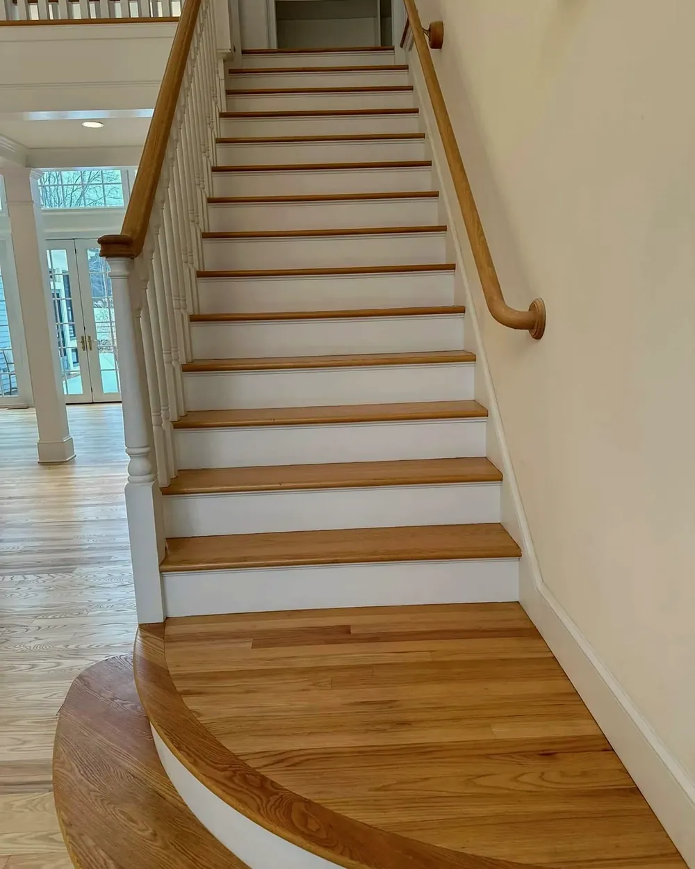 Oak stair treads and railing by Tauro Builders